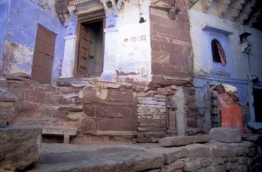 a blue painted living House in the Blue City and Town of Jodhpur in the Province of Rajasthan in India.  India, Jodhpur, January, 1998
