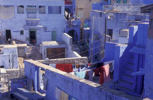 blue painted living Houses in the Blue City and Town of Jodhpur in the Province of Rajasthan in India.  India, Jodhpur, January, 1998
