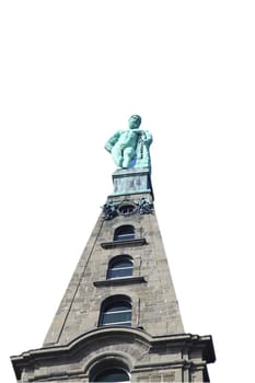 a Hercules statue with blue sky in the background