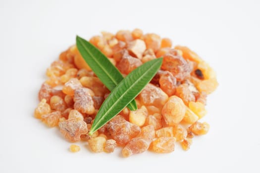 Frankincense or olibanum aromatic resin isolated on white background used in incense and perfumes.