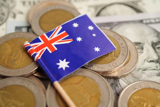 New Zealand flag on coins background, finance and accounting, banking concept.