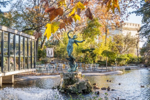 Avignon, France - November 25, 2023: Pond and statue in the garden of the Rocher des Doms, city of Avignon, department of Vaucluse, France