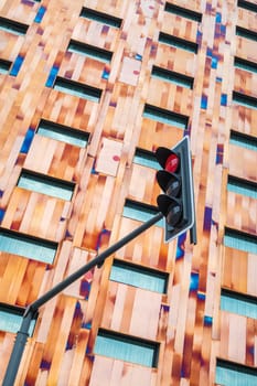 Lille, France - August 16 2022: Facade of the Crowne Plaza Hotel Lille-Euralille and red traffic light in Lille, France