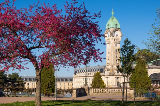 Limoges, France - April 04 2023: View of the famous Limoges train station called Limoges-Bénédictins and flowering tree