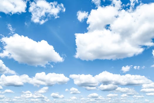 Beautiful blue sky and white cumulus clouds abstract background. Cloudscape background. Blue sky and fluffy white clouds on sunny days. Blue sky and daylight. World Ozone Day. Ozone layer. Summer sky.