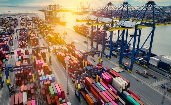 Logistics and transportation of container cargo ship at ship port. Container truck and crane bridge in shipyard. Import export and transport industry. Terminal port for export transport by ship.