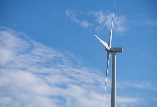 Wind turbines against blue sky, Wind energy. Wind power. Sustainable, renewable energy. Wind turbine generate electricity. Sustainable resources. Green technology for energy sustainability.