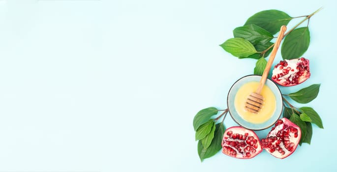 Rosh hashanah, jewish new year holiday, background with pomegranate and honey, traditional food for celebration