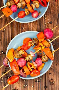BBQ vegetable skewers. Colorful grilled summer seasonal vegetables skewers.