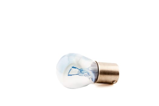 Car light bulb with filament for tail, brake and indicator lights. Selective focus with shallow depth of field.