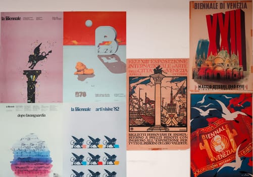Venice, Italy - May 7, 2024:  60th Venice Art Biennale in Venice. Old posters advertising the Venice Biennale presented in the central pavilion in Giardini