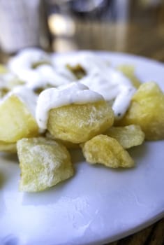 Detail of cold potatoes with sauce, lunch and fun