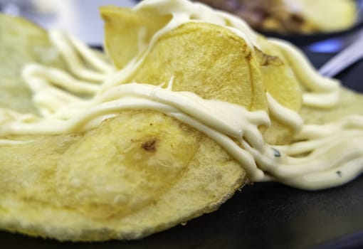 Detail of cold potatoes with sauce, lunch and fun