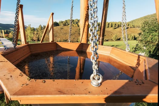 Big vat with hot water and herbs for bathing, spa and relax. Outdoor in Altai mountains, Siberia, Russia