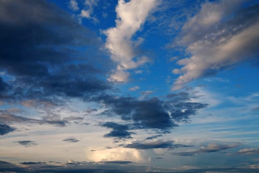 A beautiful summer sunset with a white-blue sky