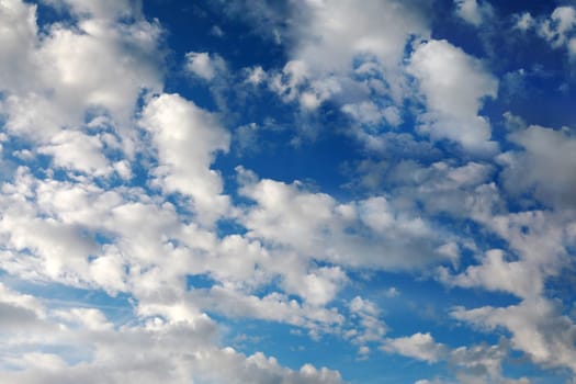 A blue sky with soft white clouds over Bavaria