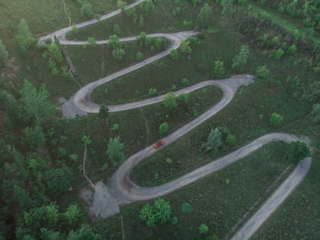 Aerial top vew of winding road in the city, drone shot