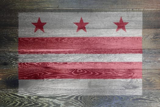 A Washington DC flag on rustic old wood surface