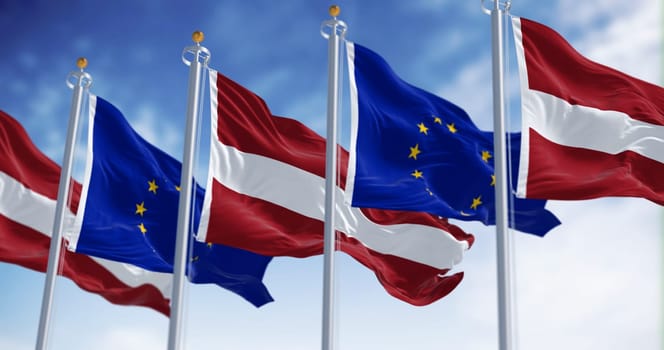 Flags of Latvia and the European Union waving on a clear day. Latvia is a member of the European Union and the Eurozone. 3d illustration render. Fluttering fabric
