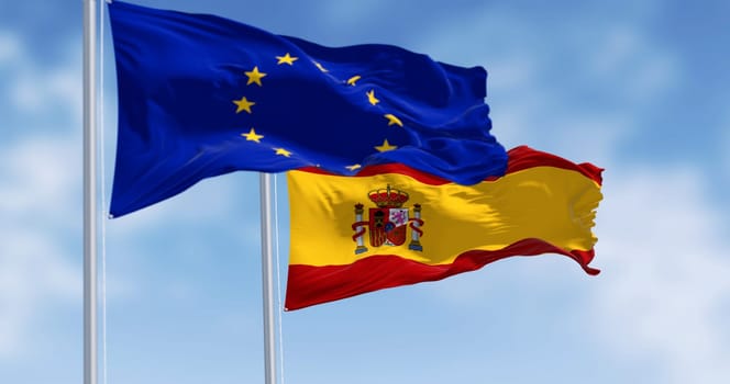 National flag of Spain waving with the European Union flag on a clear day. International cooperation. 3d illustration render. Rippled fabric. Selective focus