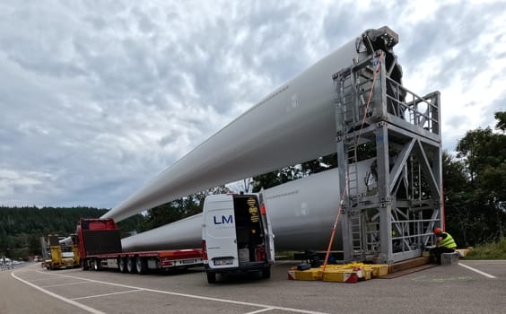 Further rotor blades for the wind farm at Schauinsland are ready for installation in the parking lot at the Feldberg Pass  The heavy transport of the 68-metre-long rotor blades leads over the Feldberg (Breisgau-Hochschwarzwald district) to Freiburg's local mountain,the Schauinsland  The rotor blades are mounted on a self-propelled vehicle,and they reach their destination at walking pace over several days  Topic picture wind energy