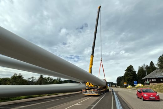 Like the pipes of a pipeline,the rotors are ready for transport on the self-propelled vehicle  The heavy transport of the 68-metre-long rotor blades leads over the Feldberg (Breisgau-Hochschwarzwald district) to Freiburg's local mountain,the Schauinsland  The rotor blades are mounted on a self-propelled vehicle,and they reach their destination at walking pace over several days  Topic picture wind energy