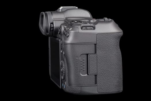 Canon R5 - black professional 35mm full-frame mirrorless camera body with flip screen isolated on black background with focus stacking - Tula, Russia, September 15, 2021