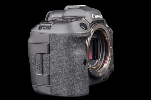 Canon R5 - black professional 35mm full-frame mirrorless camera body with flip screen isolated on black background with focus stacking - Tula, Russia, September 15, 2021