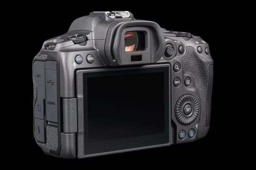 Canon R5 - black professional 35mm full-frame mirrorless camera body with flip screen isolated on black background with focus stacking - Tula, Russia, September 15, 2021