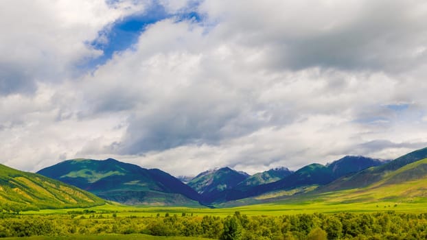 panorama of Semenovskoye gorge in Kyrgyzstan at cloudy summer day.