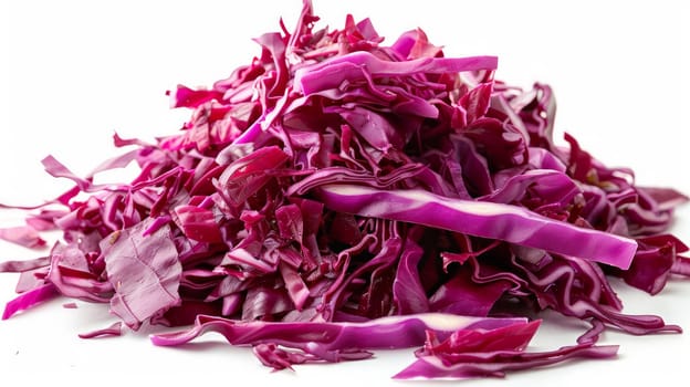 Pile of shredded red cabbage on a white background .