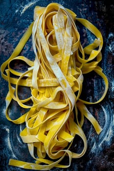 A bunch of freshly cut noodles and dough on the table with flour.