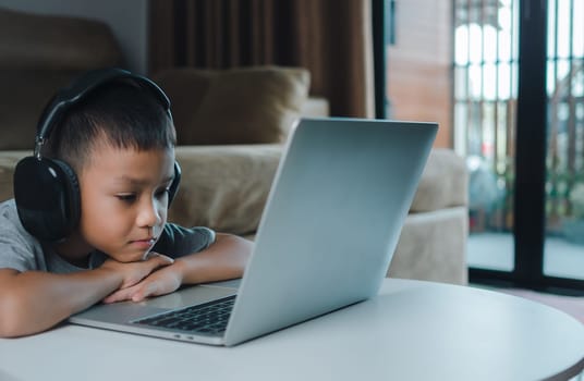 Online education, Technology studying at home using laptop computer, Student distance learning virtual distance online class on video call virtual lesson, Teaching child boy with remote education.