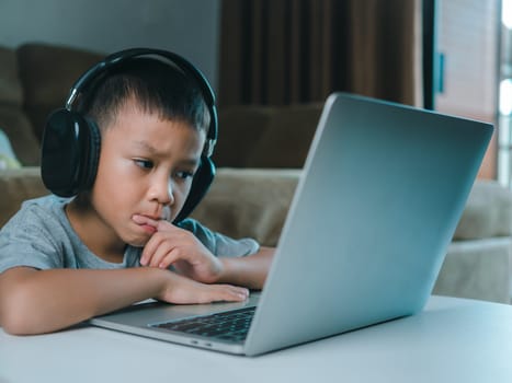 Online education, Technology studying at home using laptop computer, Student distance learning virtual distance online class on video call virtual lesson, Teaching child boy with remote education.