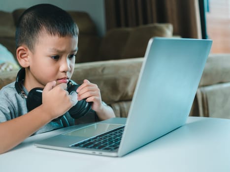 Online education, Technology studying at home using laptop computer, Student distance learning virtual distance online class on video call virtual lesson, Teaching child boy with remote education.