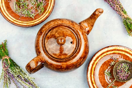 Natural herbal tea made from fresh heather. Alternative medicine and naturopathy concept.