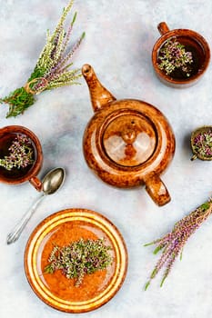 Natural herbal tea made from fresh heather. Alternative medicine and naturopathy concept.