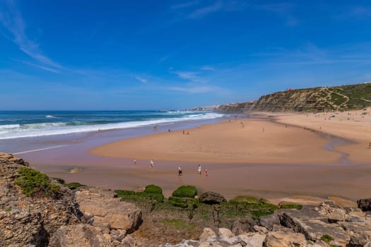 Sintra, Portugal: April 13, 2024: People at the beach of Foz do Lizandro, Ericeira, Portugal