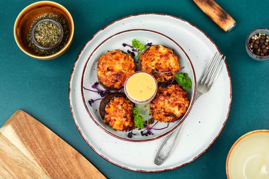 Delicious stuffed mushrooms, champignon mushroom caps stuffed with vegetables. Top view.