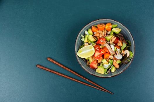 Salad with calamari, shrimp, clams and fresh vegetables. Copy space.
