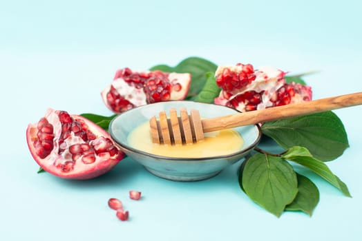 Rosh hashanah, jewish new year holiday, background with pomegranate and honey, traditional food for celebration