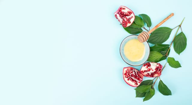 Rosh hashanah, jewish new year holiday, background with pomegranate and honey, traditional food for celebration