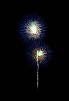 Blue fireworks sparkling on night sky. Celebration and anniversary concept.