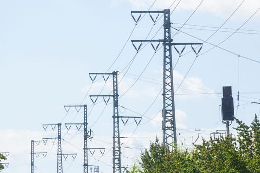 Power line, power poles, railroad system, blue sky, Germany