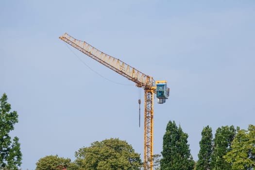 Orange construction crane, blue sky, Verden an der Aller, Lower Saxony, Germany