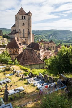 Old cliffside village of Saint-Cirq-Lapopie and Saint-Cirq-et-Sainte-Juliette church in the Occitanie region of South West France