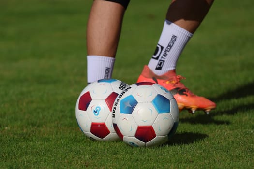 Match ball and football boots - the football season is in full swing