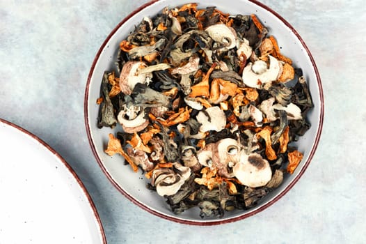 A variety of dried mushrooms. Preparation of dried mushrooms. Dry dehydrated sliced mushrooms.