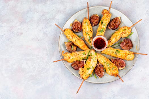 Shish kebab with chicken fillet and sweet figs. Grilled meat skewers. BBQ, chicken skewers.