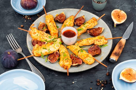 Shish kebab with chicken fillet and sweet figs. Grilled meat skewers. BBQ, chicken skewers.